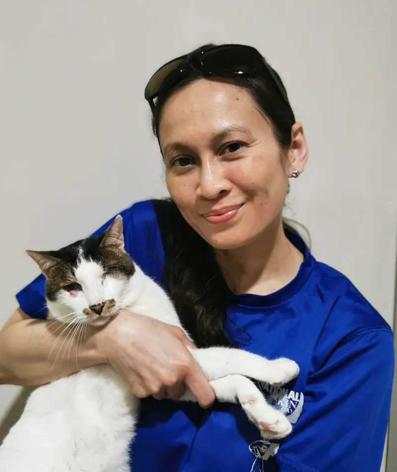 Dr Kartini Farah Rahim holding a rescued one-eyed cat