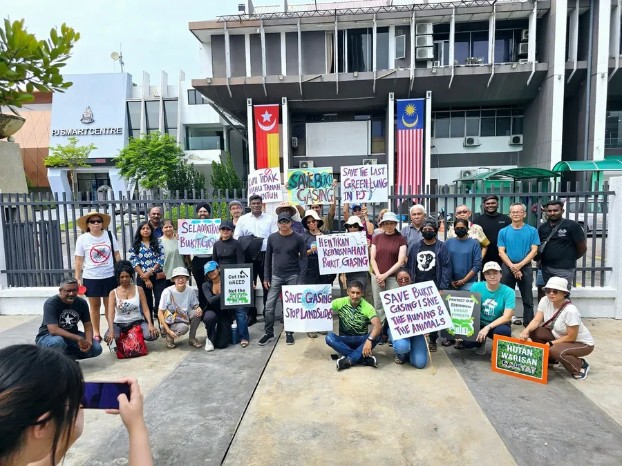 Community members holding signs to save Bukit Gasing forest in Petaling Jaya